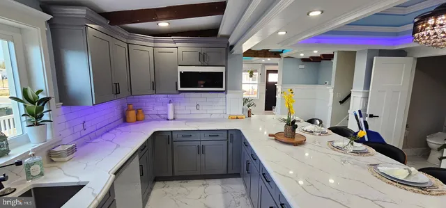 a kitchen with a sink stove and refrigerator