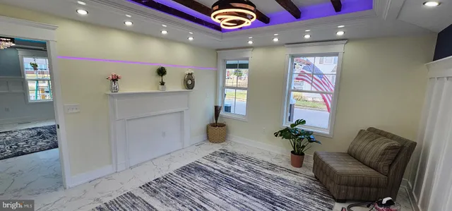 a hallway with painting and flower vase