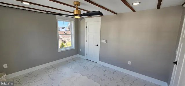 a view of an empty room with a sliding door