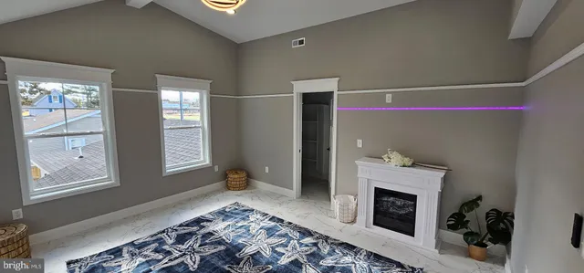 a utility room with a stove and a sink