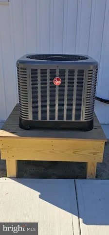 a kitchen with stainless steel appliances kitchen island granite countertop a sink and cabinets