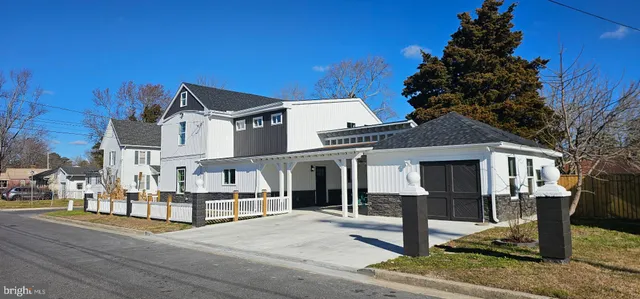 a view of multiple houses with a street