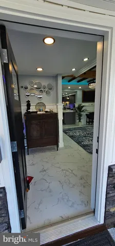 a bathroom with a glass door shower and a sink