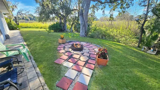 an aerial view of a house with big yard