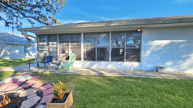 a view of front door of house with outdoor seating