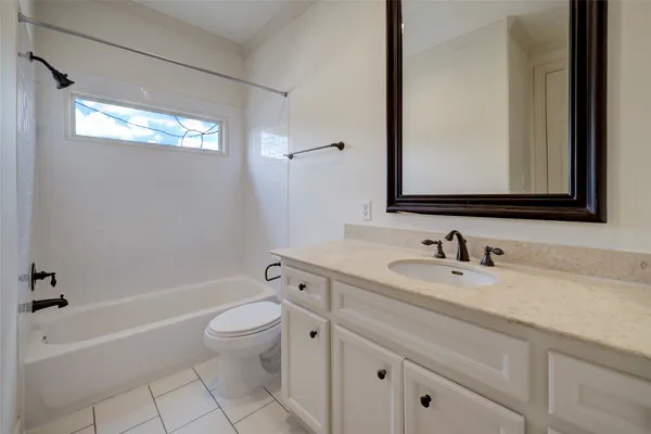a bathroom with a sink a toilet and a bathtub