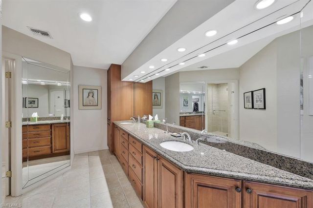 a bathroom with sink and mirror
