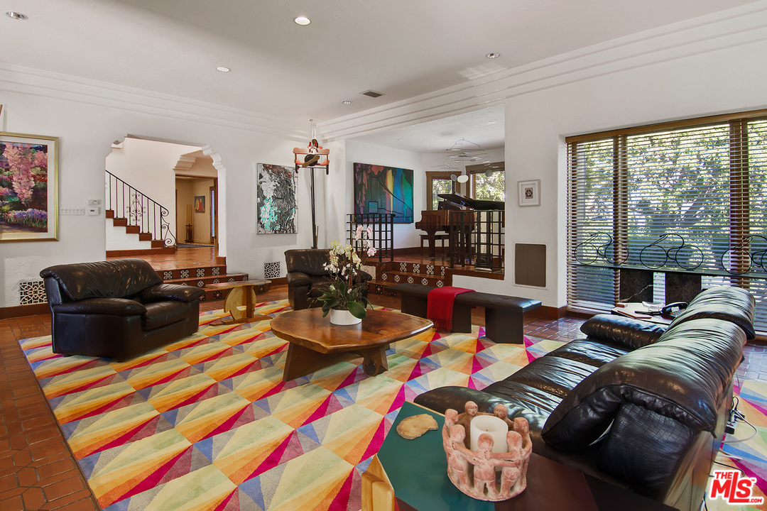 701 North Alpine Drive Beverly Hills, CA 90210 - Photo 5 of 22 a living room with furniture fireplace and large window