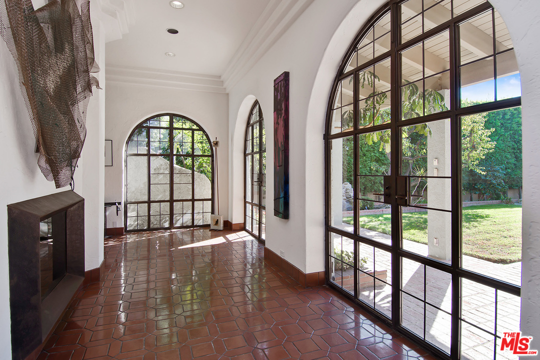 701 North Alpine Drive Beverly Hills, CA 90210 - Photo 7 of 22 a view of an entryway with a garden