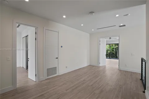 a view of a room with wooden floor and balcony
