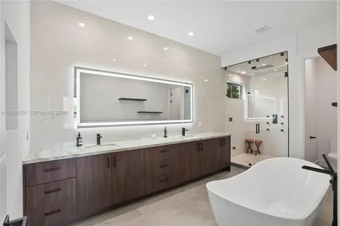 a white bath tub sitting in a bathroom