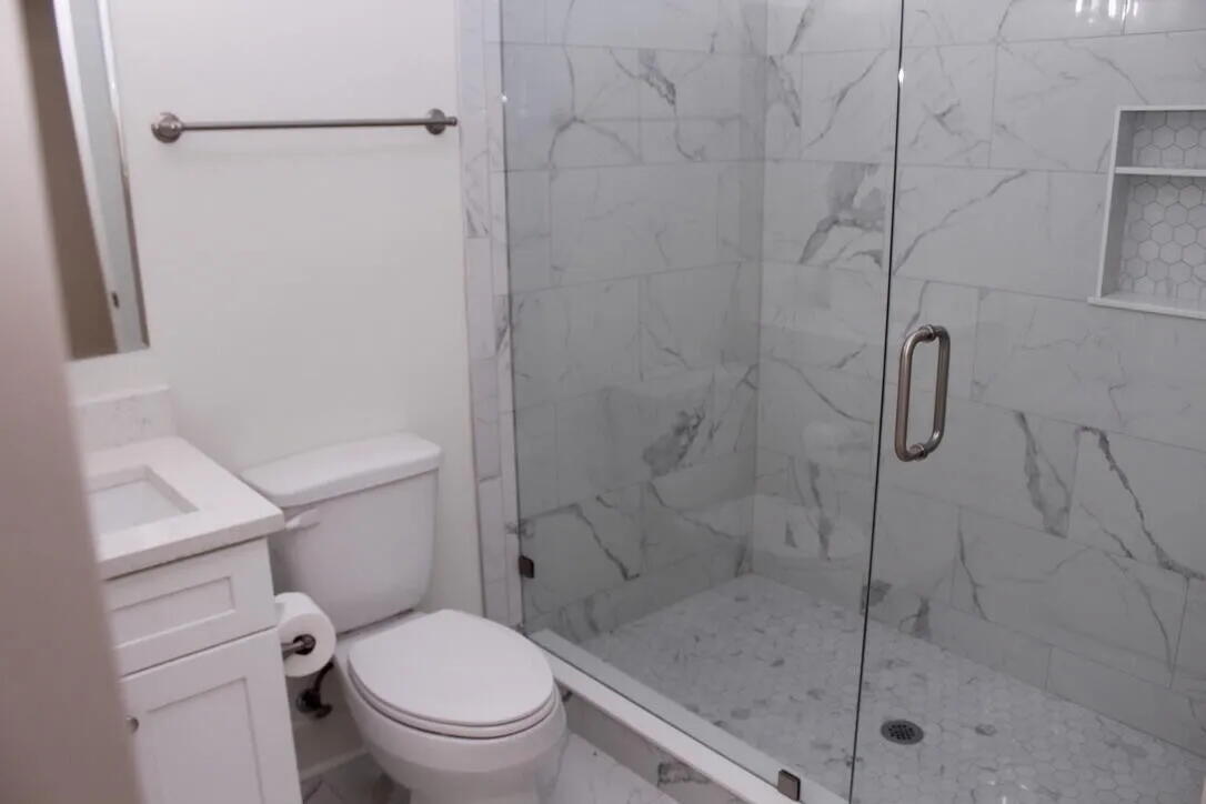 54 Davis Street DeFuniak Springs, FL 32435 - Photo 11 of 14 a white toilet next to a bathroom