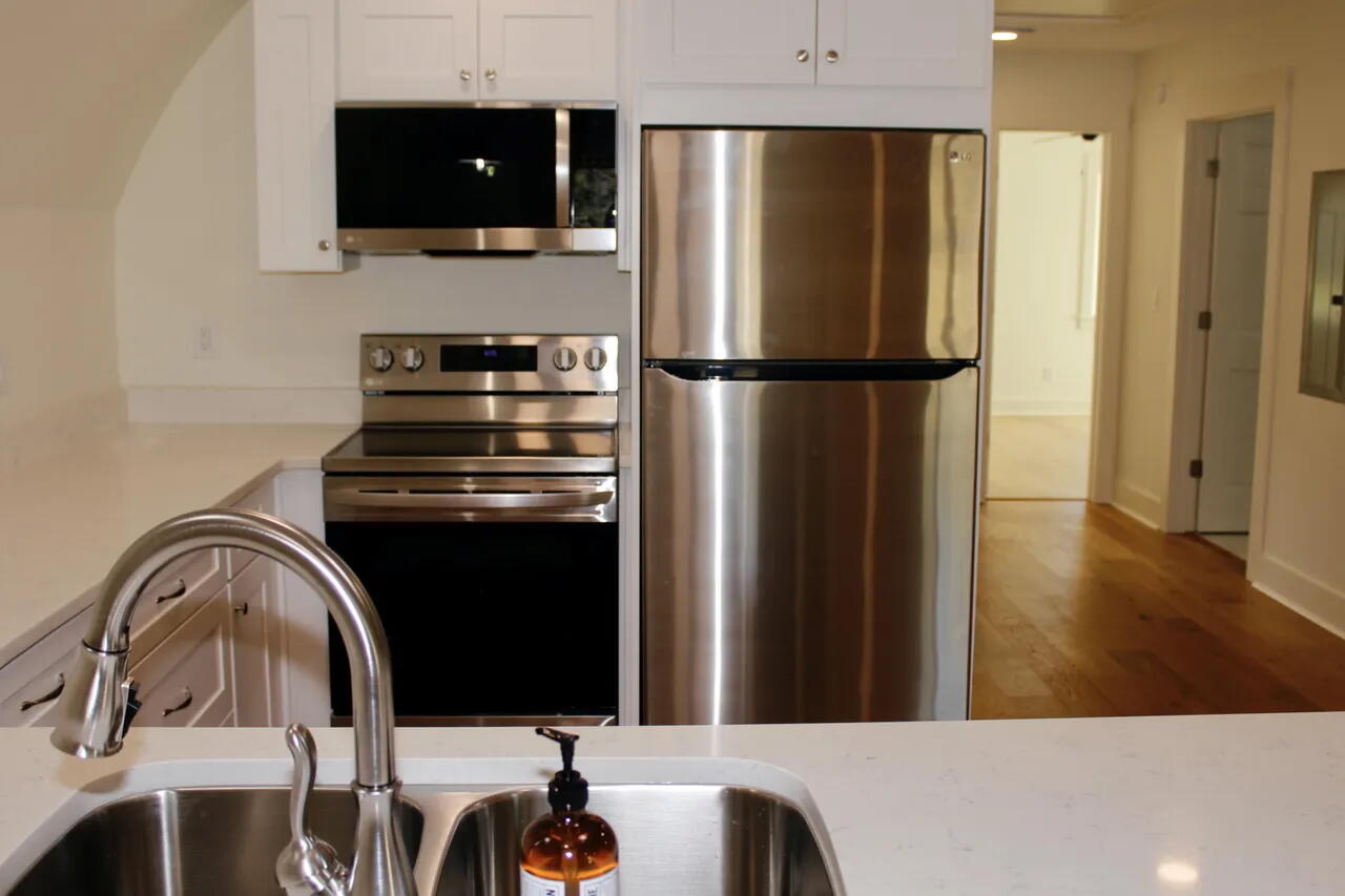 54 Davis Street DeFuniak Springs, FL 32435 - Photo 5 of 14 a kitchen with a refrigerator and a microwave