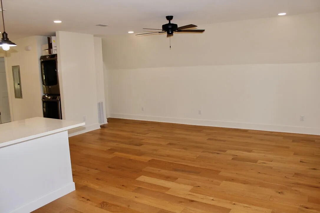 54 Davis Street DeFuniak Springs, FL 32435 - Photo 6 of 14 a view of a kitchen with a sink and a refrigerator