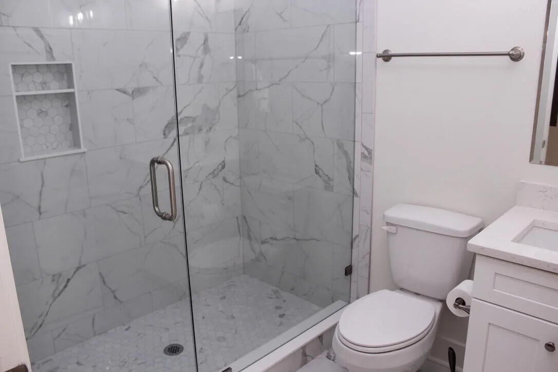 54 Davis Street DeFuniak Springs, FL 32435 - Photo 10 of 14 a a bathroom with a toilet and shower