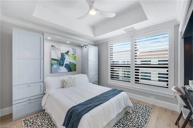 a view of tall buildings with swimming pool and seating space