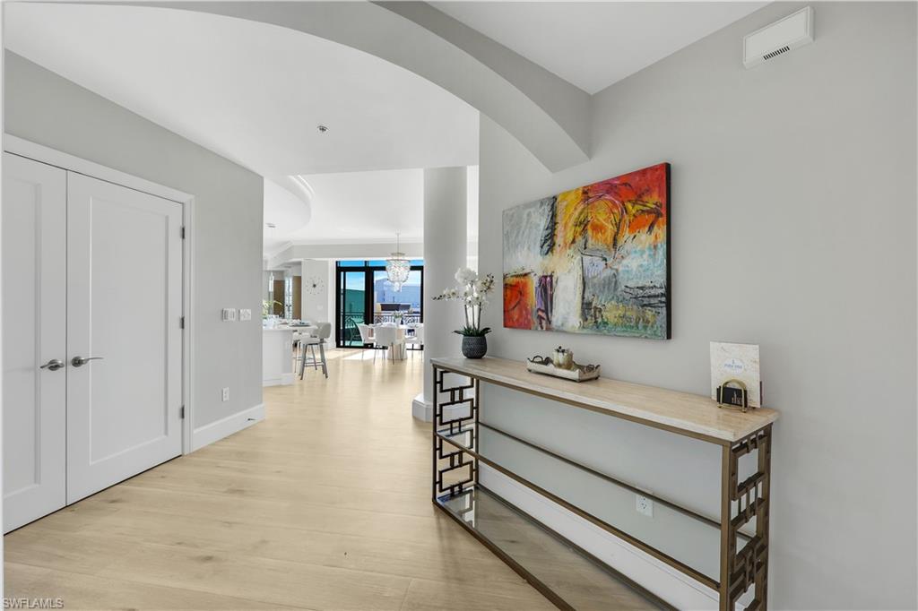 9115 Strada Place, Unit 5502 Naples, FL 34108 - Photo 30 of 48 Foyerl with light wood flooring and baseboards
