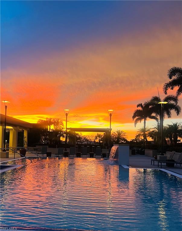 9115 Strada Place, Unit 5502 Naples, FL 34108 - Photo 34 of 48 Community pool sunset view