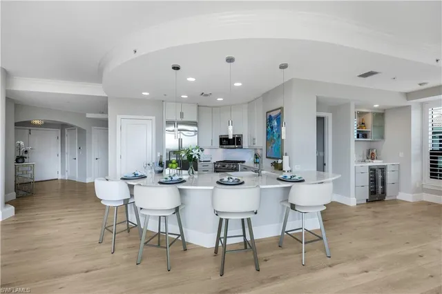 a view of a balcony and wooden chairs