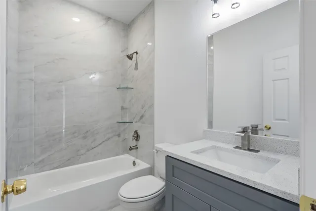 a bathroom with a sink a toilet and a bathtub