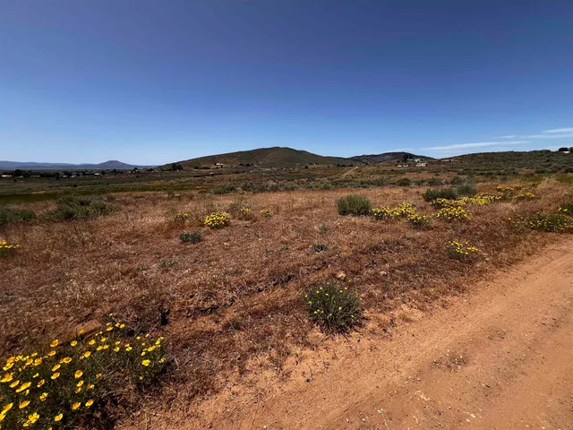 a view of mountain with sunset