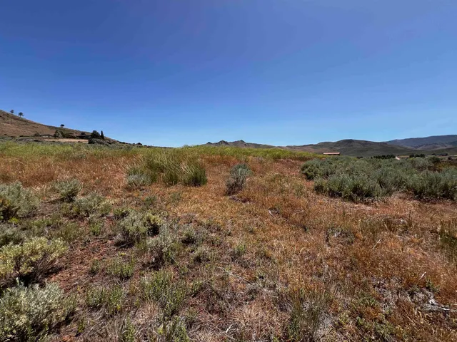 a view of a lake with mountains in the background