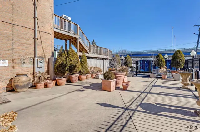 a view of a building with sitting area