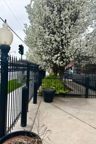 a view of a porch with furniture and garden