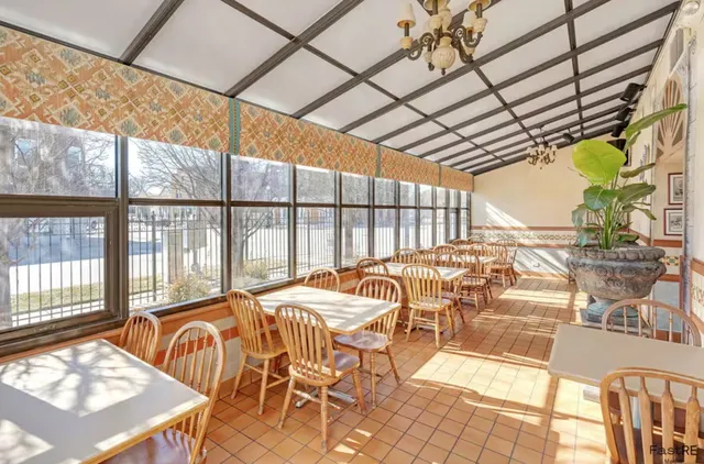 a view of a swimming pool with outdoor seating