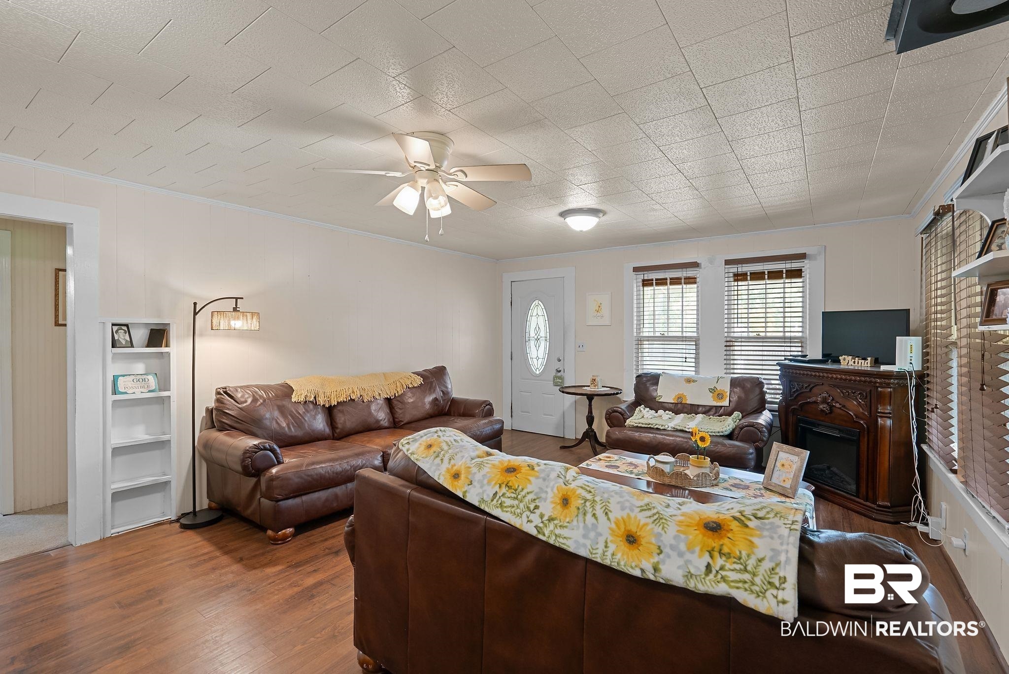 615 West Section Avenue Foley, AL 36535 - Photo 7 of 40 Living area featuring wood-finish flooring, white paneled walls, and a recessed ceiling