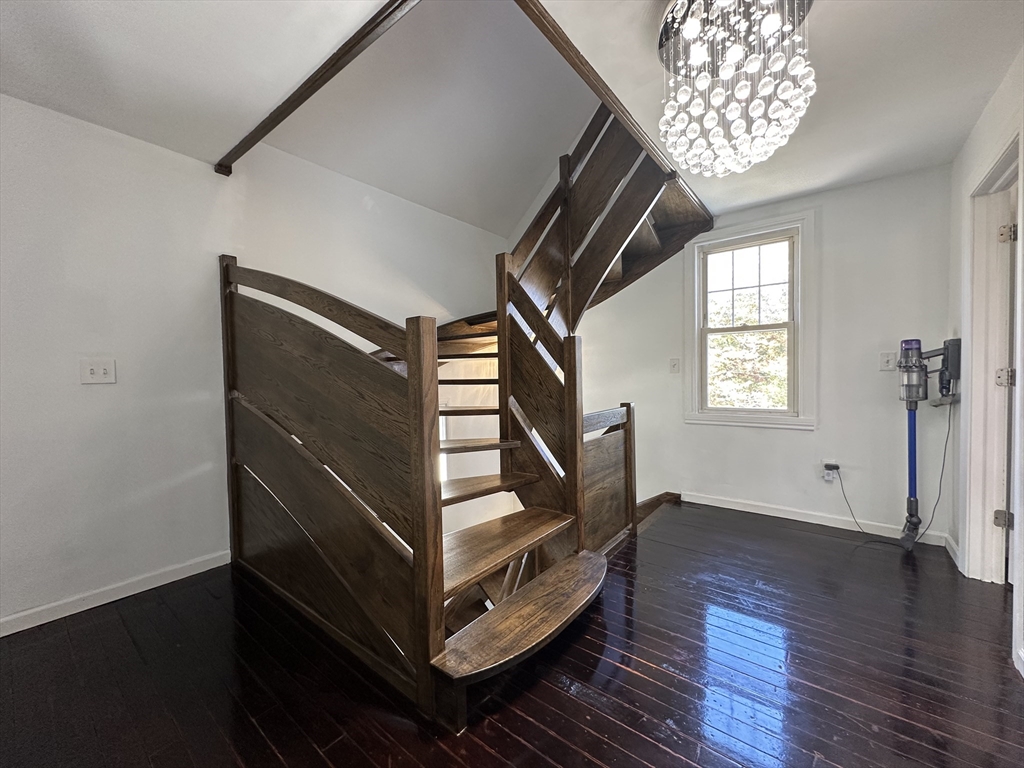 712 Cooper Street Agawam, MA 01001 - Photo 19 of 26 a view of entryway with stairs and wooden floor
