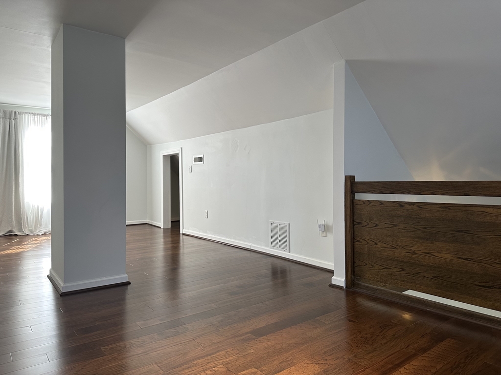 712 Cooper Street Agawam, MA 01001 - Photo 21 of 26 a view of an empty room with wooden floor