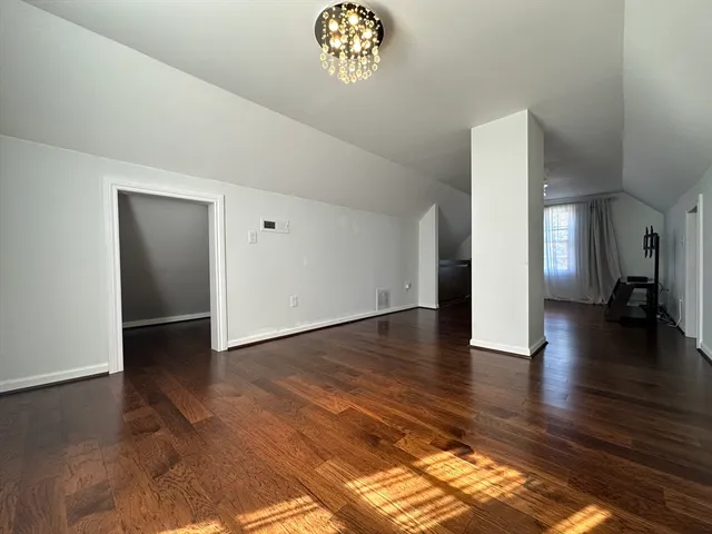 a view of an empty room and glass door
