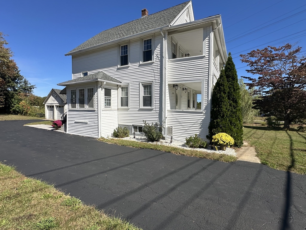 712 Cooper Street Agawam, MA 01001 - Photo 3 of 26 a front view of a house with a yard