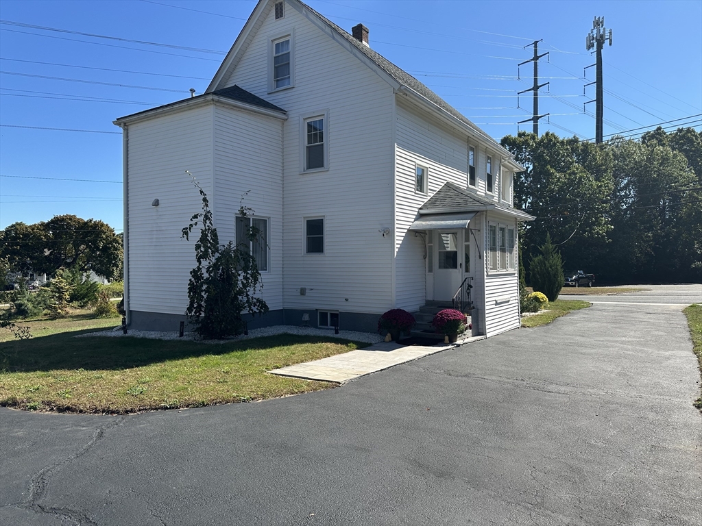 712 Cooper Street Agawam, MA 01001 - Photo 4 of 26 a view of a house with backyard and sitting area