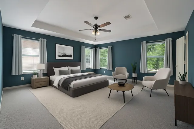 a view of a room with a ceiling fan and a window