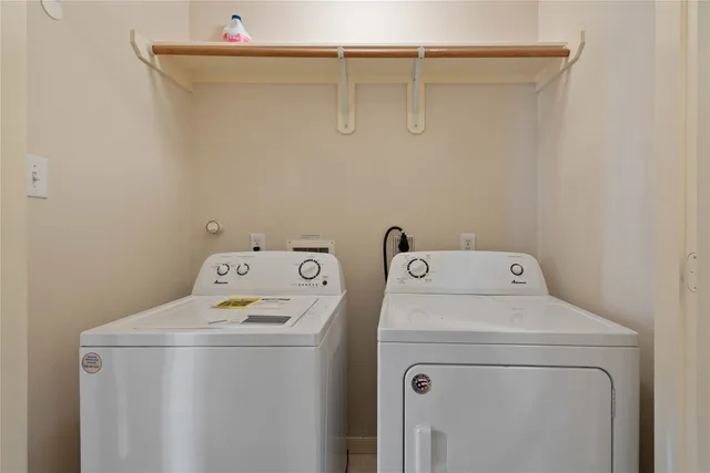 a view of room with a ceiling fan and a window