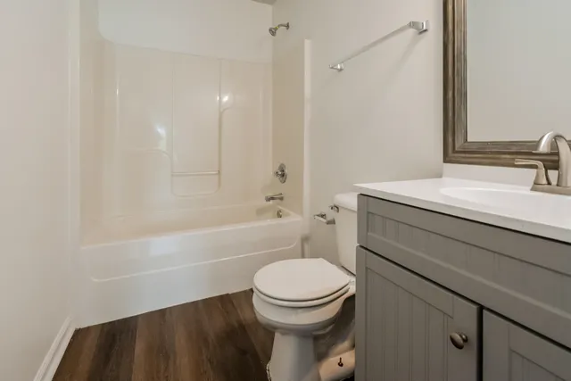 a bathroom with a sink a toilet and a bathtub