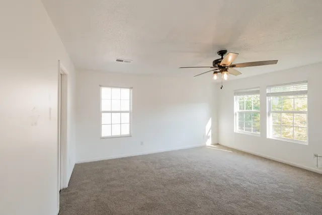 a view of empty room with windows