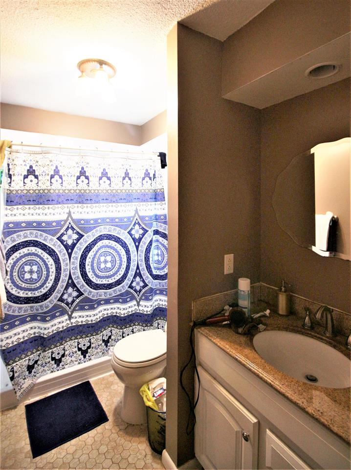 2992 Charles Bryan Road Bartlett, TN 38134 - Photo 16 of 18 a bathroom with a toilet and a sink