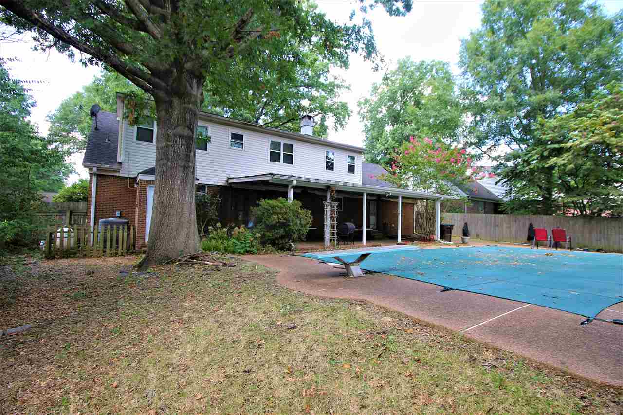 2992 Charles Bryan Road Bartlett, TN 38134 - Photo 17 of 18 a front view of a house with a yard and trees