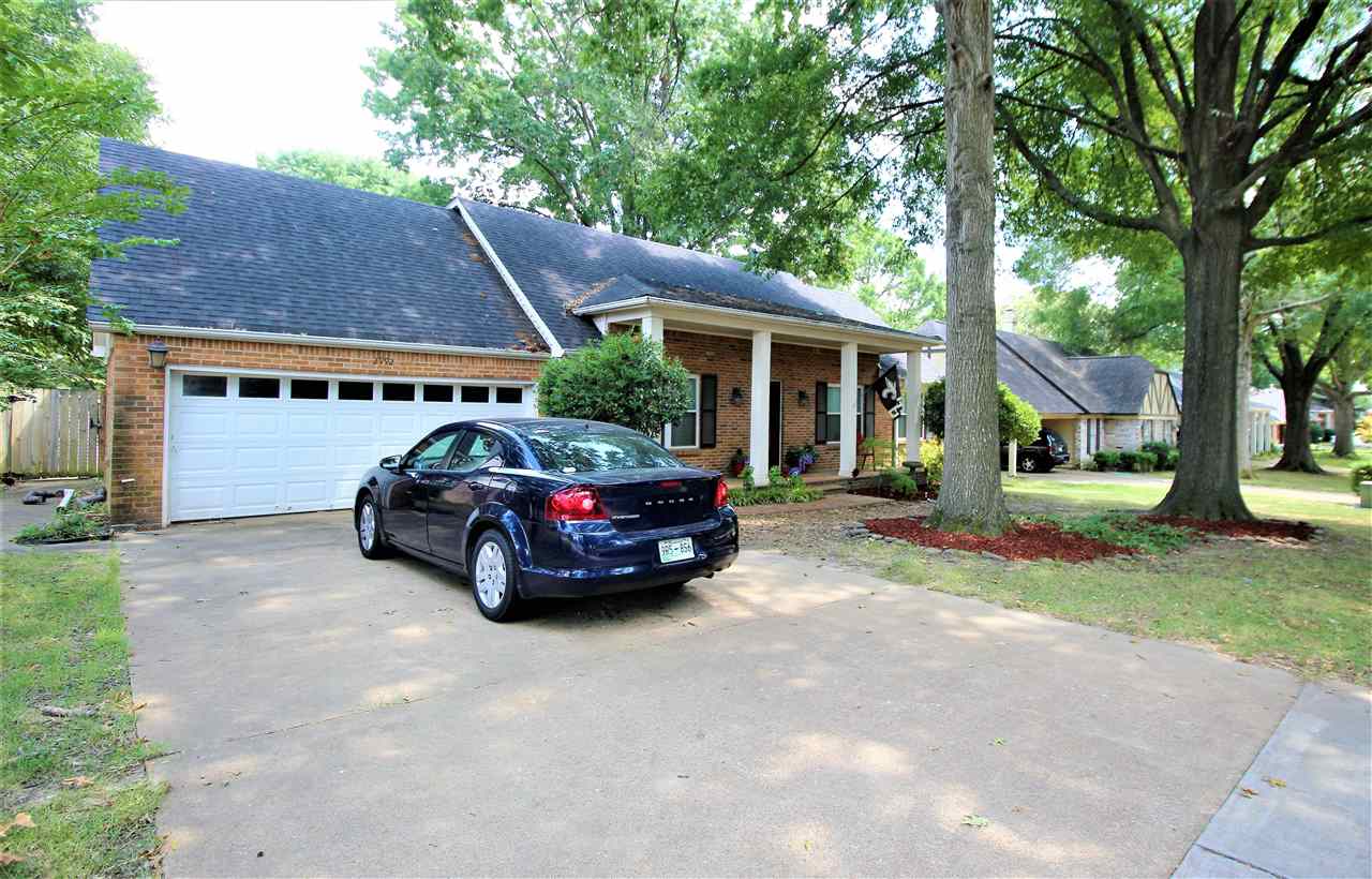 2992 Charles Bryan Road Bartlett, TN 38134 - Photo 3 of 18 a car parked in front of a house next to a yard