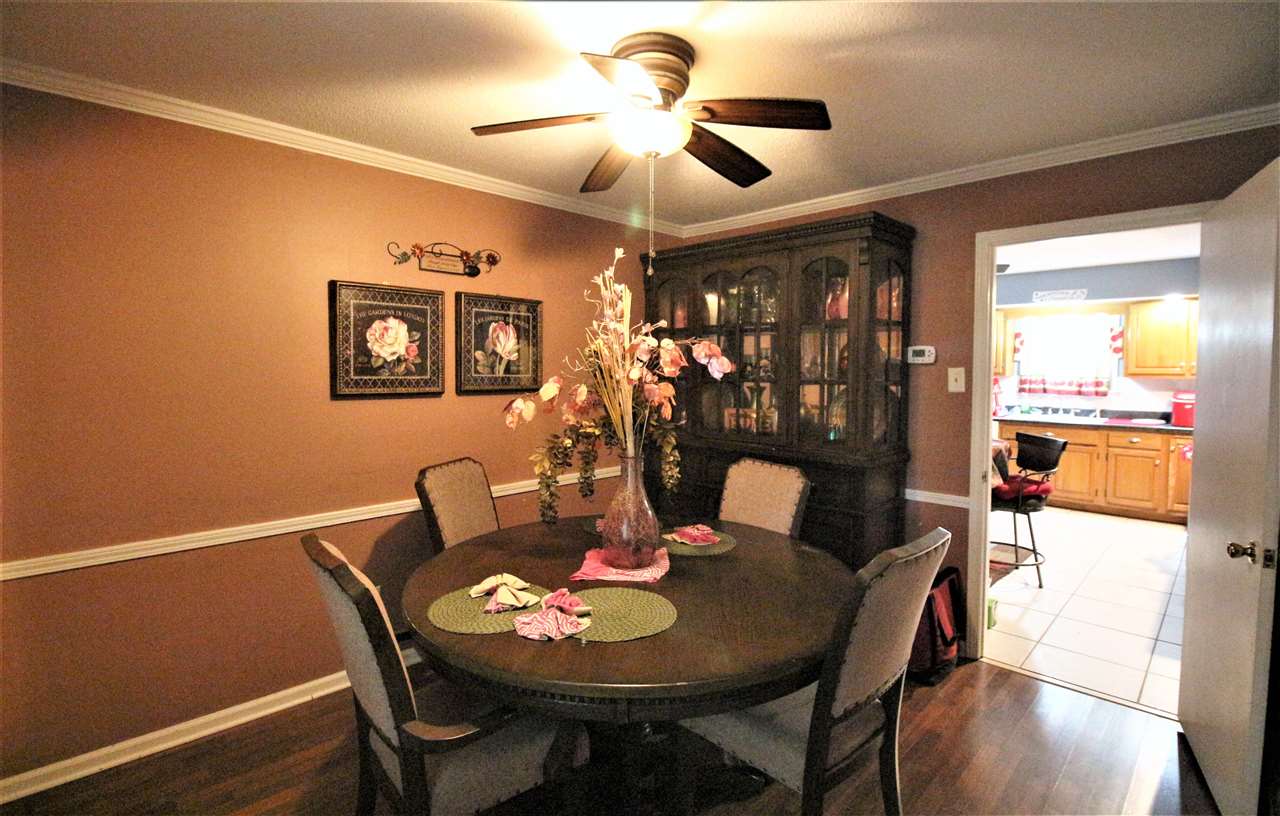 2992 Charles Bryan Road Bartlett, TN 38134 - Photo 8 of 18 a view of a dining room with furniture and wooden floor