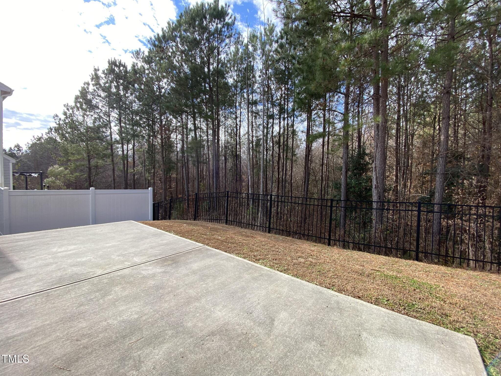 3545 Massey Ridge Court Raleigh, NC 27616 - Photo 33 of 38 a wooden fence under a large trees
