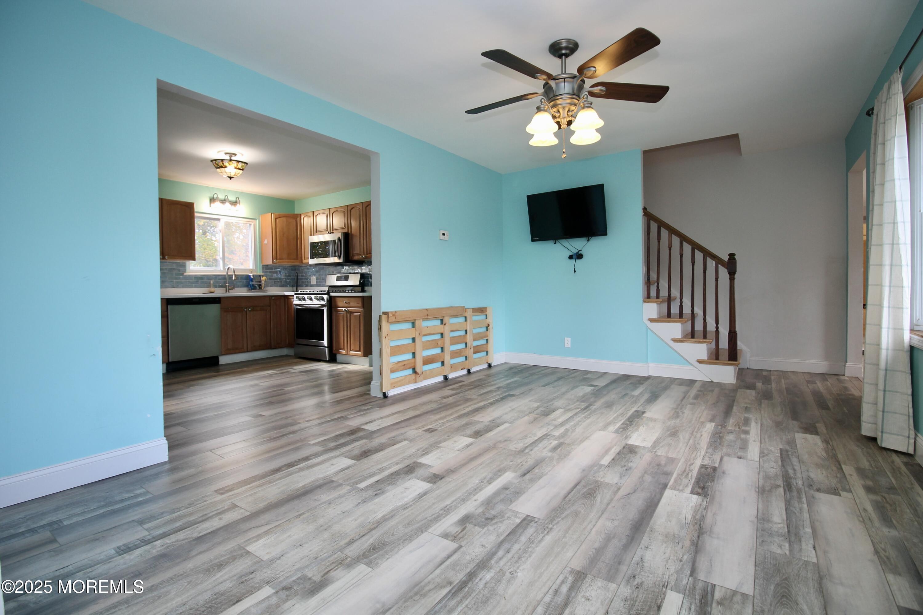 16 Maple Lane Howell, NJ 07731 - Photo 11 of 55 a view of kitchen and dining room with wooden floor