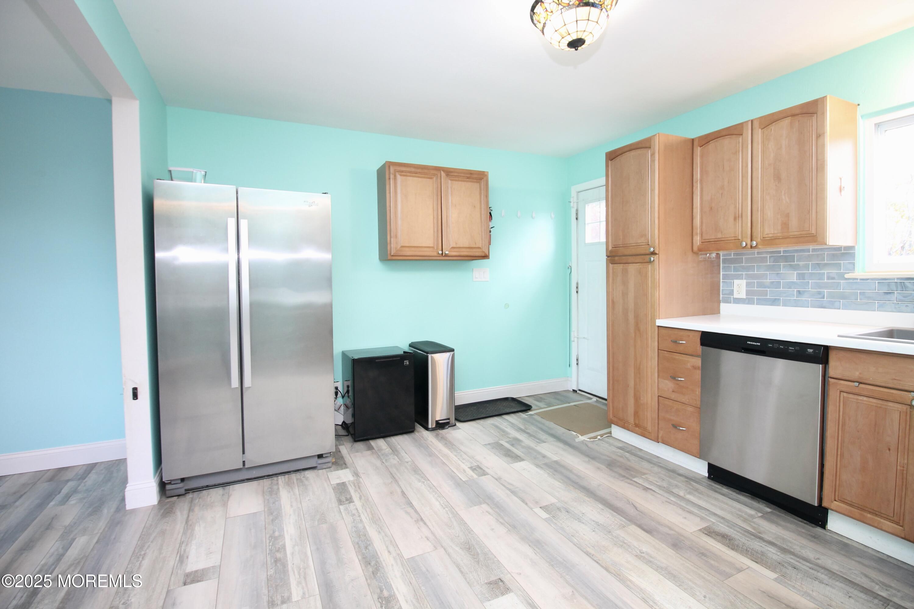 16 Maple Lane Howell, NJ 07731 - Photo 17 of 55 a kitchen with stainless steel appliances granite countertop a refrigerator and a sink