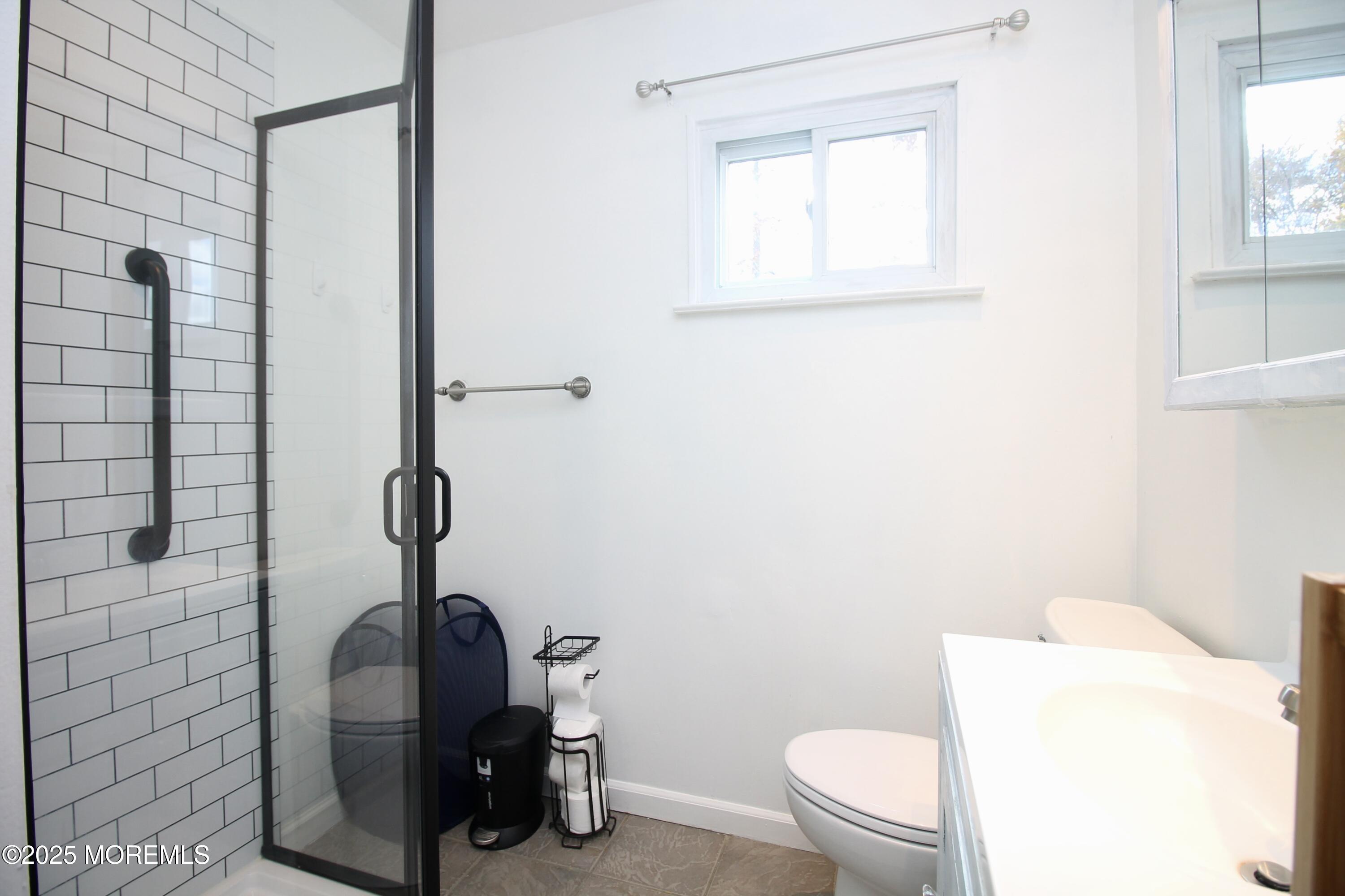 16 Maple Lane Howell, NJ 07731 - Photo 20 of 55 a bathroom with a toilet and a shower