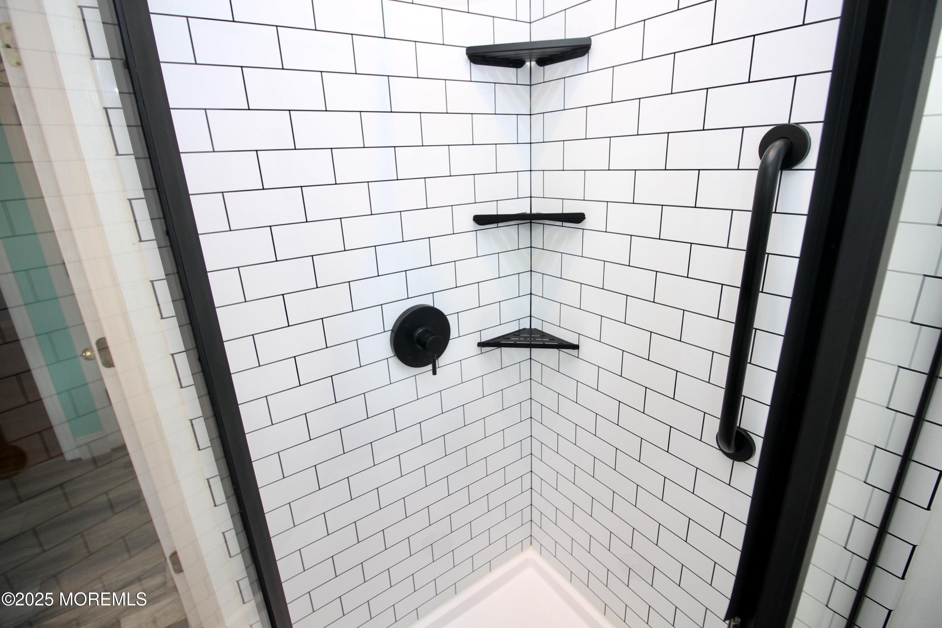 16 Maple Lane Howell, NJ 07731 - Photo 21 of 55 a bathroom with a shower and a tiled wall