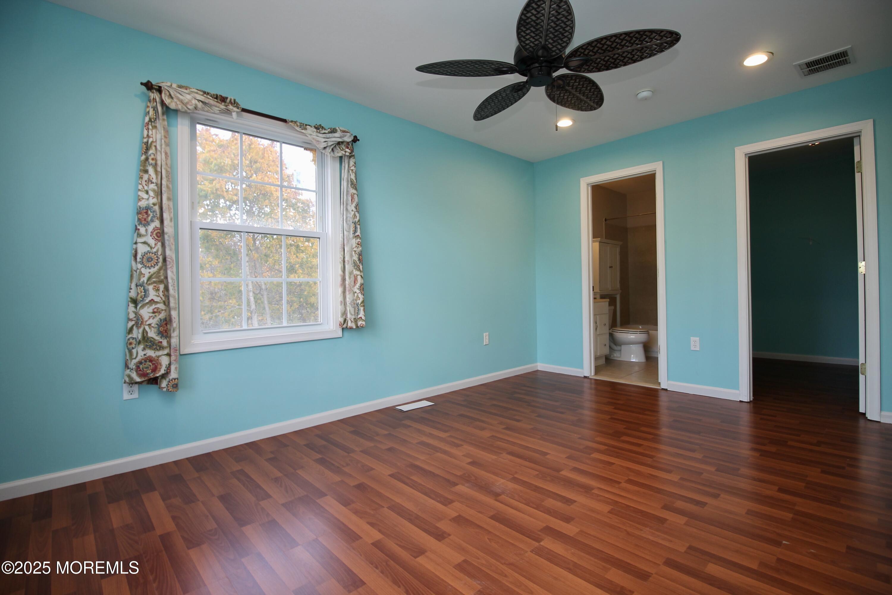 16 Maple Lane Howell, NJ 07731 - Photo 32 of 55 wooden floor in an empty room with a window