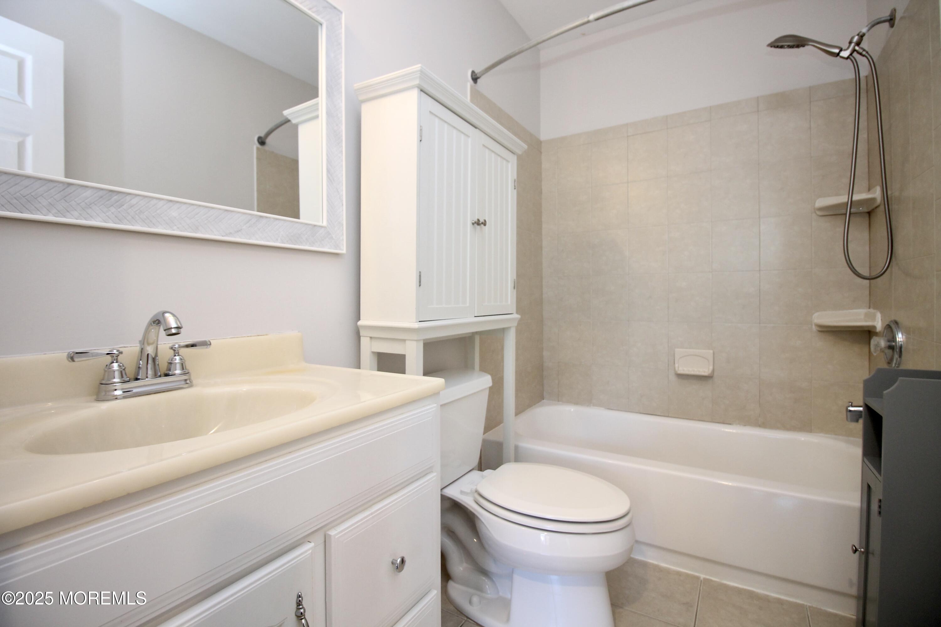 16 Maple Lane Howell, NJ 07731 - Photo 34 of 55 a bathroom with a sink a toilet and a bathtub